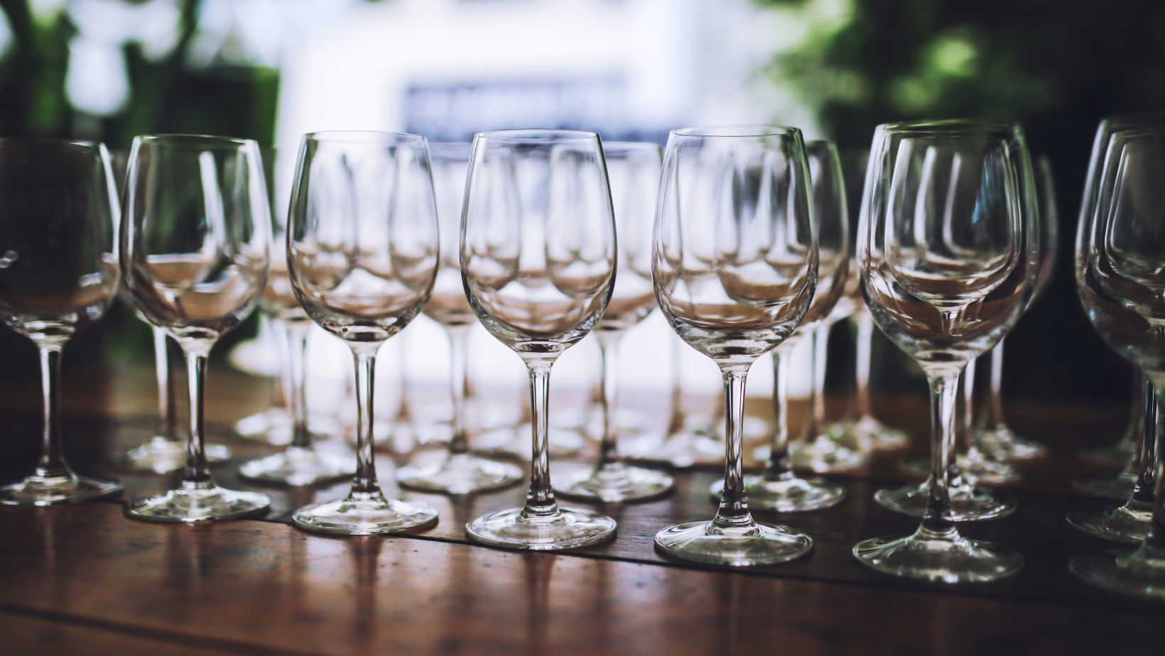 Should wine glasses be stored and served facing up or down?