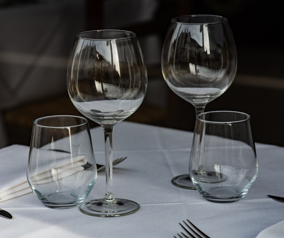 Should wine glasses be stored and served facing up or down?