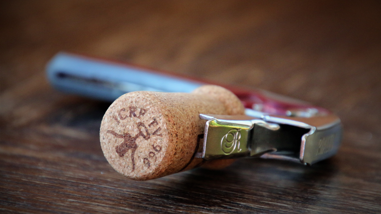 Where should we put the cork after opening the bottle of wine?